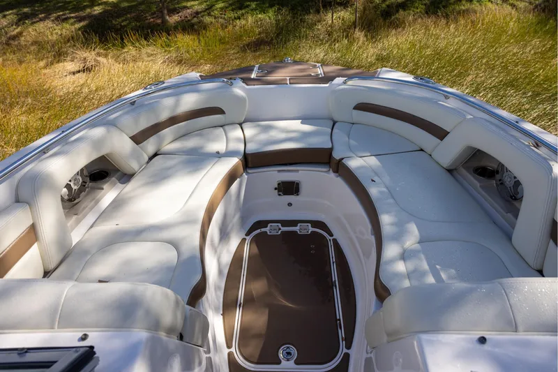 Slide: The Image of 2018 Chaparral 264 Sunesta boat interior with spacious seating and elegant design. - 11