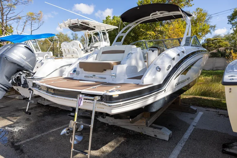 Slide: The Image of 2018 Chaparral 264 Sunesta boat on display, featuring sleek design and Yamaha engine. - 3