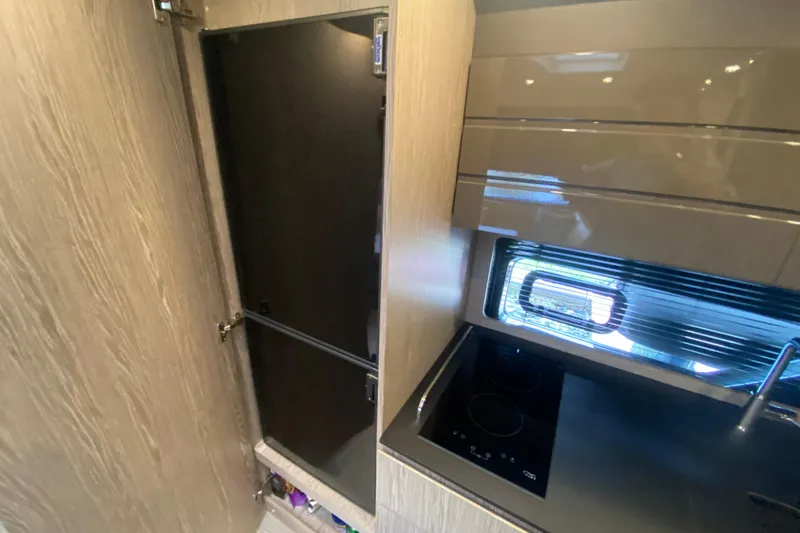 Slide: The Image of Modern kitchen interior of 2021 Azimut Atlantis 45 yacht with sleek cabinetry and appliances. - 43