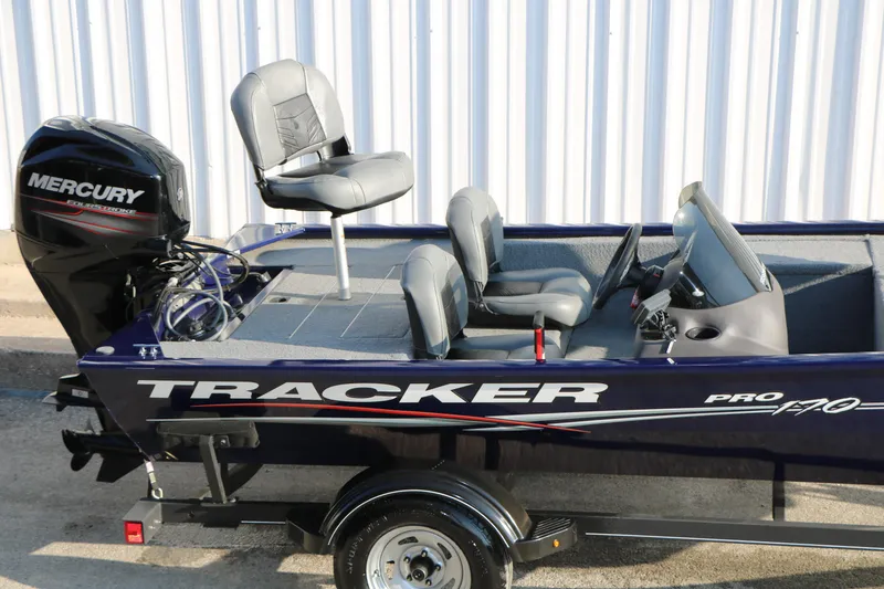 Slide: The Image of 2019 Tracker Pro 170 boat with Mercury engine, featuring comfortable seating and sleek design. - 10