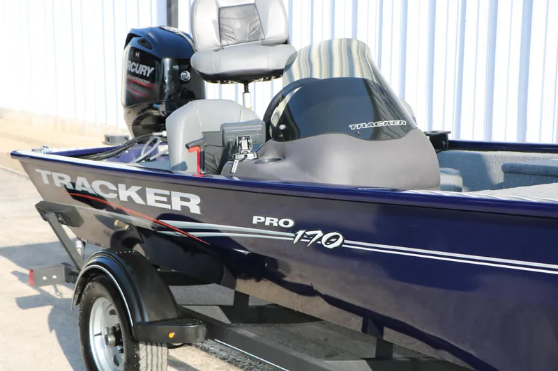 Slide: The Image of 2019 Tracker Pro 170 boat with Mercury engine, parked outdoors. - 13