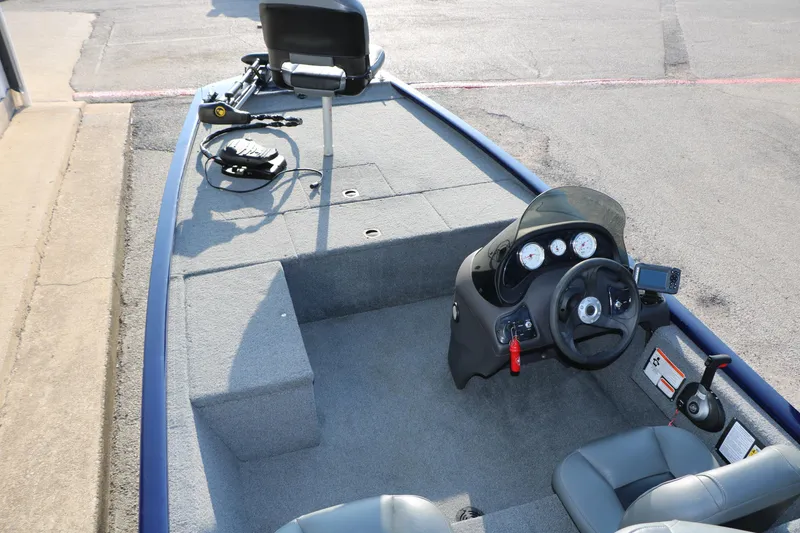 Slide: The Image of 2019 Tracker Pro 170 boat interior with steering console and seating. - 14