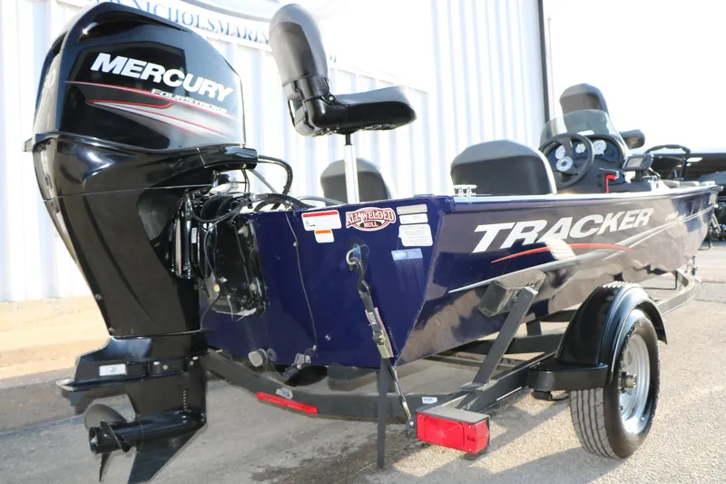 Slide: The Image of 2019 Tracker Pro 170 boat with Mercury engine on trailer, parked outdoors. - 6