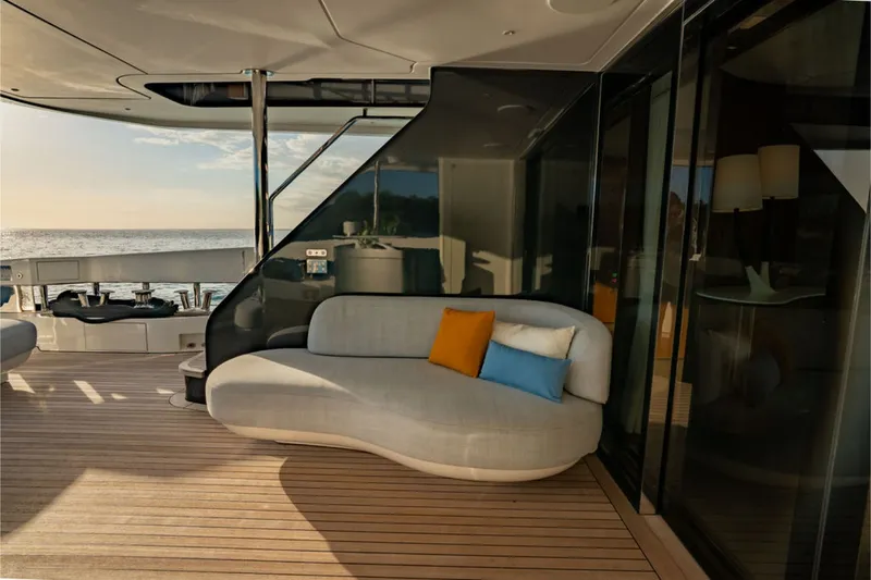 Slide: The Image of Elegant lounge on the Azimut Grande 36M with a curved sofa and cushions, overlooking the sea. - 33