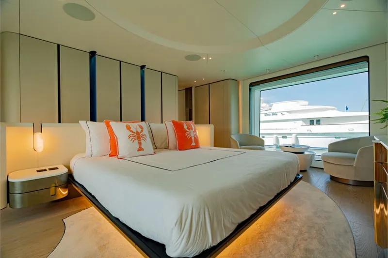 Slide: The Image of Luxurious bedroom on the Azimut Grande 36M yacht, featuring a large bed and panoramic window. - 39