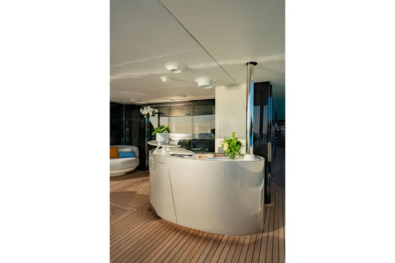 Slide: The Image of Elegant bar on the 2024 Azimut Grande 36M, featuring modern furniture and plants. - 23