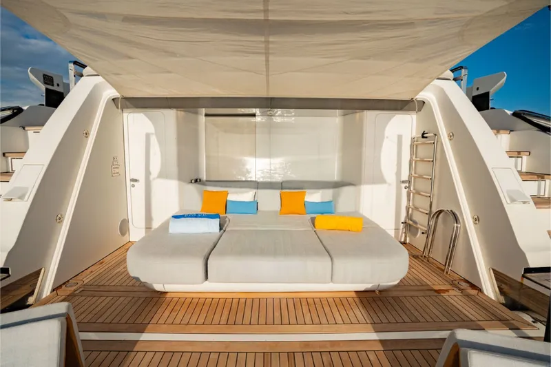 Slide: The Image of Luxurious lounging area on the 2024 Azimut Grande 36M, featuring comfortable cushions and teak decking. - 16