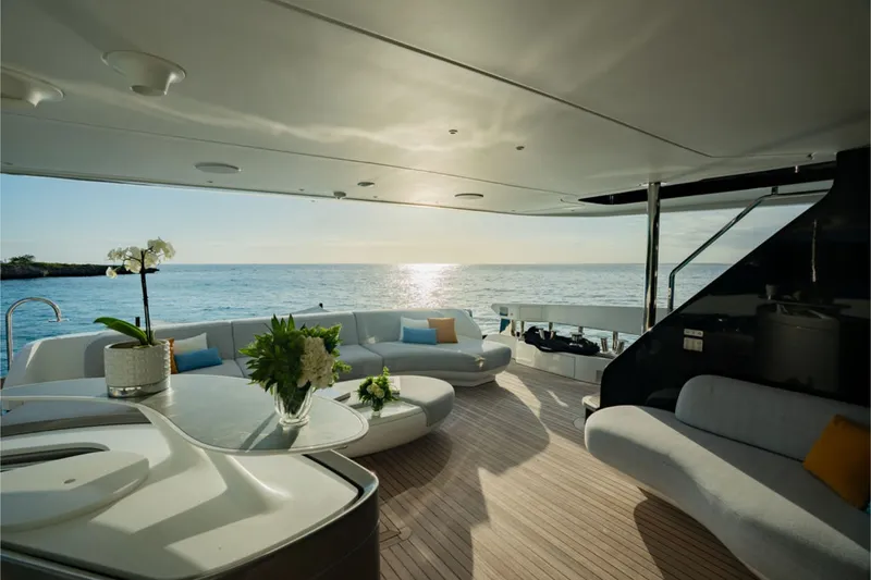 Slide: The Image of The 2024 Azimut Grande 36M features an elegant outdoor deck with stylish sofas and a sea view. - 27