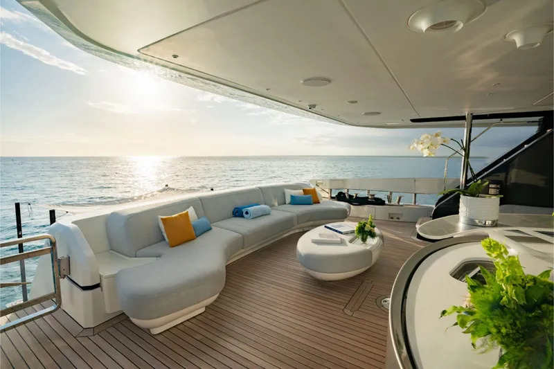 Slide: The Image of Luxurious yacht with elegant lounge, wooden deck, and ocean view at sunset. - 25