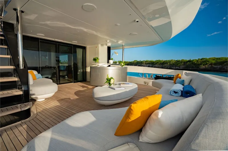 Slide: The Image of The 2024 Azimut Grande 36M features an elegant deck with modern furniture and ocean views. - 22