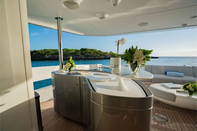 Slide: The Image of Luxurious yacht with stylish deck, sleek bar, and comfortable seating, surrounded by scenic coastal views. - 30