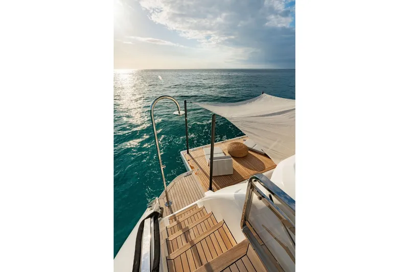 Slide: The Image of The 2024 Azimut Grande 36M features an elegant swim platform overlooking the sea. - 18
