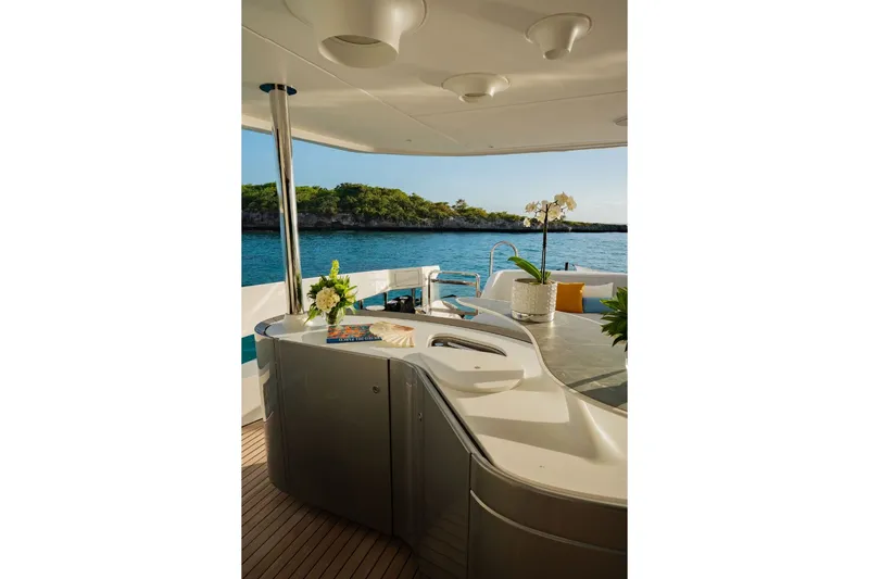 Slide: The Image of The 2024 Azimut Grande 36M features an elegant outdoor bar overlooking the sea. - 31