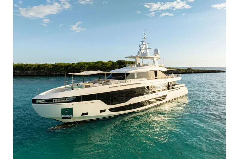 Slide: The Image of The 2024 Azimut Grande 36M is a luxurious yacht on calm, turquoise waters. - 2