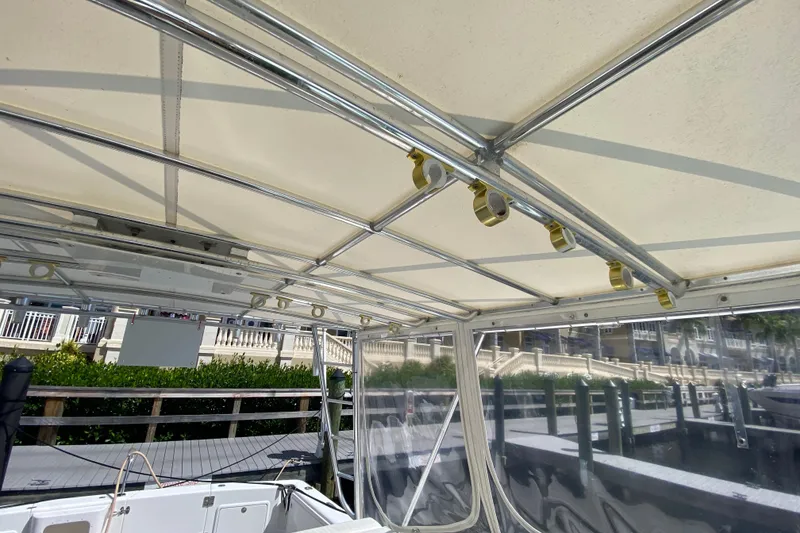 Slide: The Image of Interior view of a 2000 Riviera 4000 boat canopy with metal framework. - 34