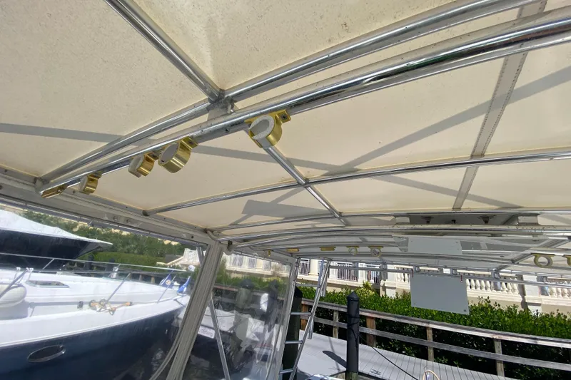 Slide: The Image of Riviera 4000 yacht canopy and framework, 2000 model, docked with clear skies. - 35