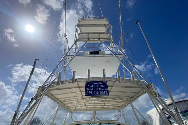 Slide: The Image of Riviera 4000 yacht tower against a bright blue sky, showcasing sleek design and structure. - 4