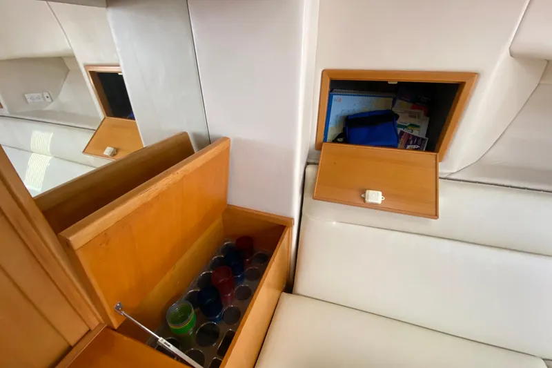 Slide: The Image of Interior of 2000 Riviera 4000 yacht with wooden storage compartments. - 48