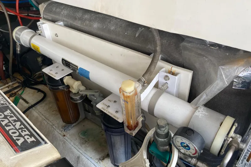 Slide: The Image of Engine compartment of a 2000 Riviera 4000 with Volvo Penta components and filtration system. - 58