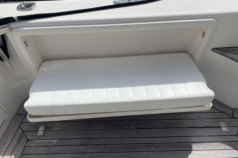 Slide: The Image of White cushioned seat on 2000 Riviera 4000 boat deck. - 7