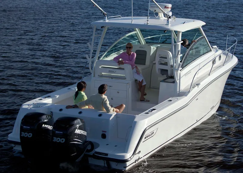 Slide: The Image of Manufacturer Provided Image: 2015 Boston Whaler 315 Conquest boat on water with people onboard. - 15