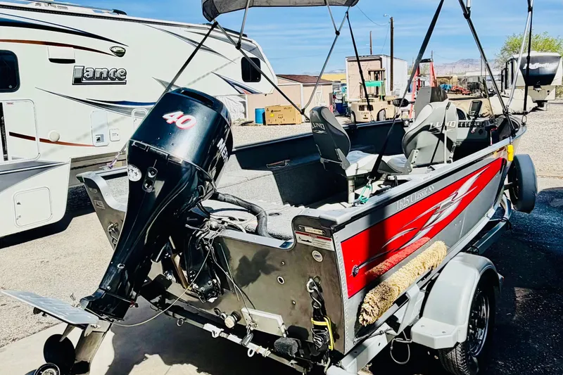 Slide: The Image of 2006 Lund 1625 Classic SS boat with Mercury 40 HP motor on trailer. - 4