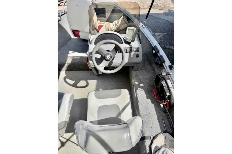 Slide: The Image of 2006 Lund 1625 Classic SS boat interior with steering wheel and seating. - 8
