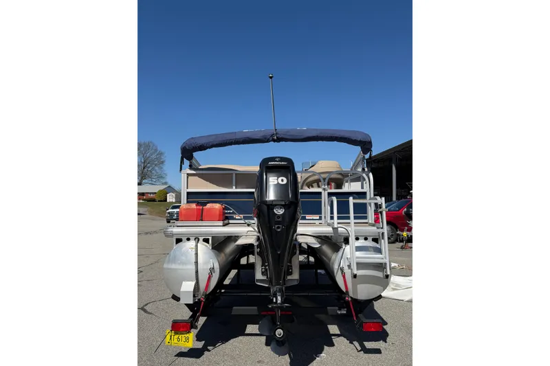 Slide: The Image of 2022 Sun Tracker Bass Buggy 16 XL pontoon boat with Mercury 50 HP engine. - 2