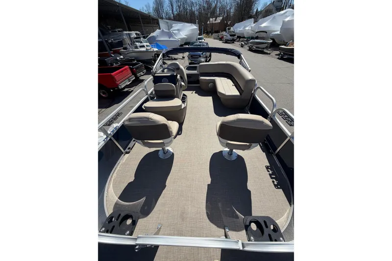 Slide: The Image of 2022 Sun Tracker Bass Buggy 16 XL pontoon boat interior with seating and open deck. - 5