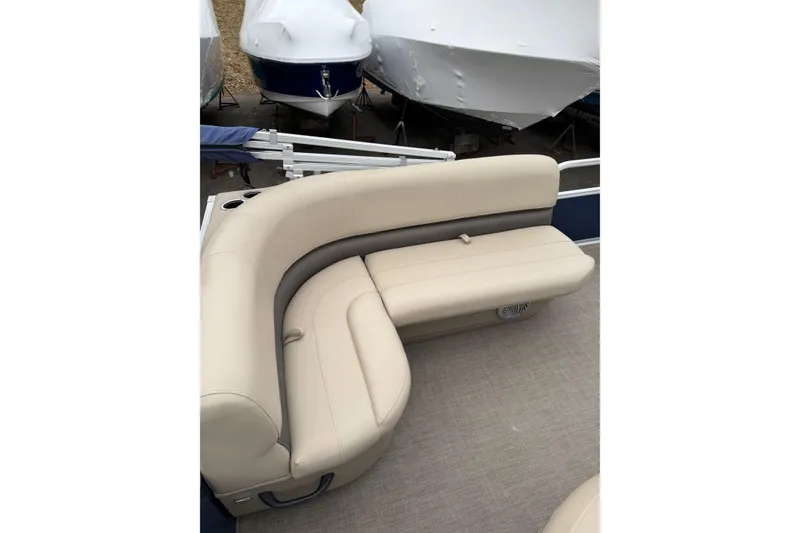 Slide: The Image of 2022 Sun Tracker Bass Buggy 16 XL pontoon boat with beige seating. - 9