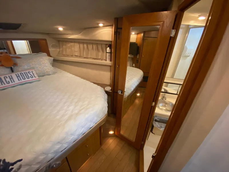 Slide: The Image of 2001 Bayliner 3988 yacht interior with cozy bedroom and bathroom. - 27