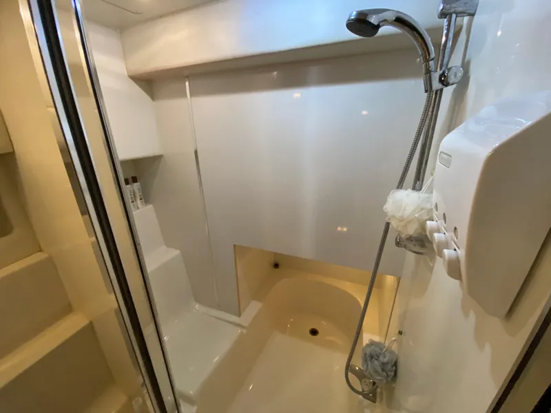 Slide: The Image of Bathroom interior of 2001 Bayliner 3988 yacht with shower and bathtub. - 34