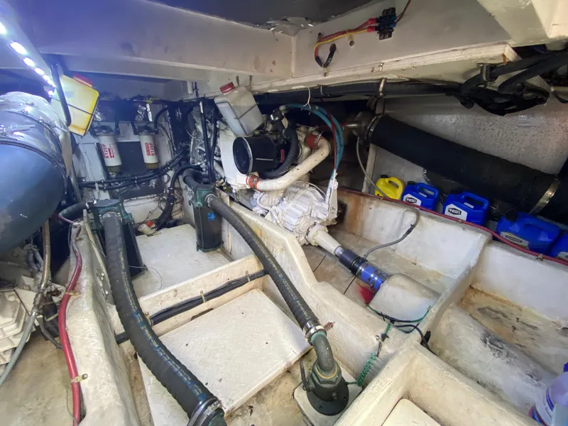 Slide: The Image of Engine room of a 2001 Bayliner 3988 boat, showcasing mechanical components and equipment. - 38