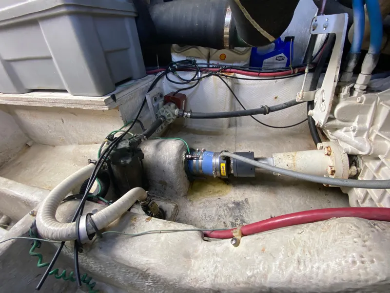 Slide: The Image of Engine compartment of a 2001 Bayliner 3988 boat, showing mechanical components and wiring. - 40