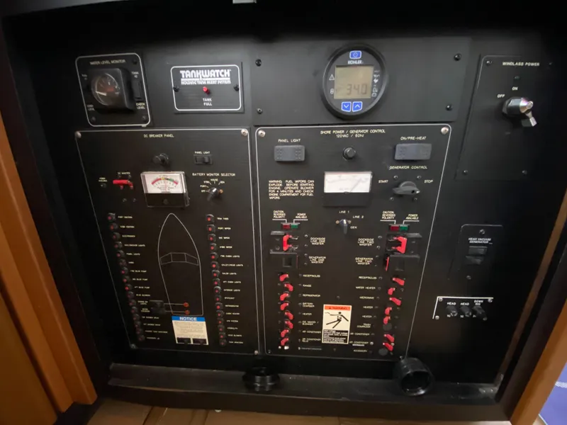 Slide: The Image of Control panel of a 2001 Bayliner 3988 boat, featuring various switches and gauges. - 9