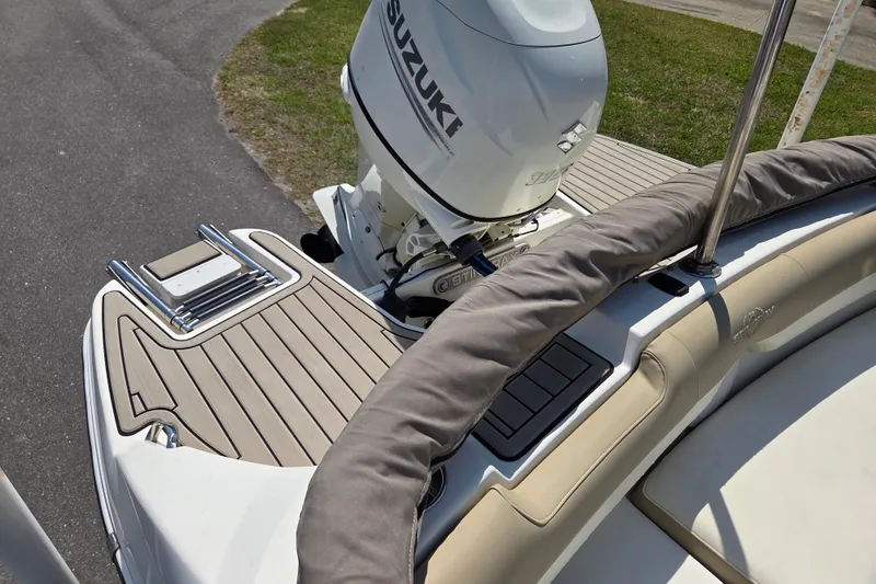 Slide: The Image of 2017 Stingray 191 DC boat with Suzuki engine, featuring a sleek deck design. - 12