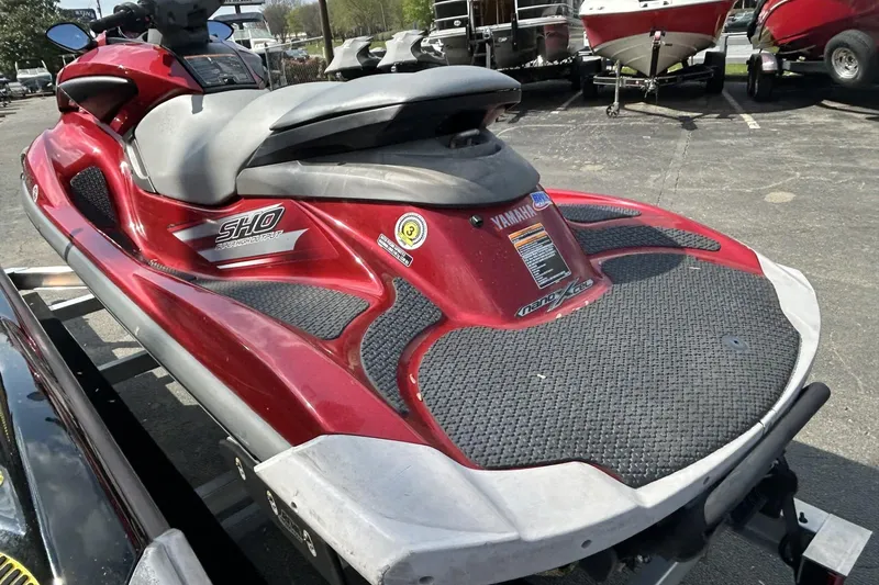 Slide: The Image of 2011 Yamaha WaveRunner FZS in red, parked on a trailer in a lot. - 5