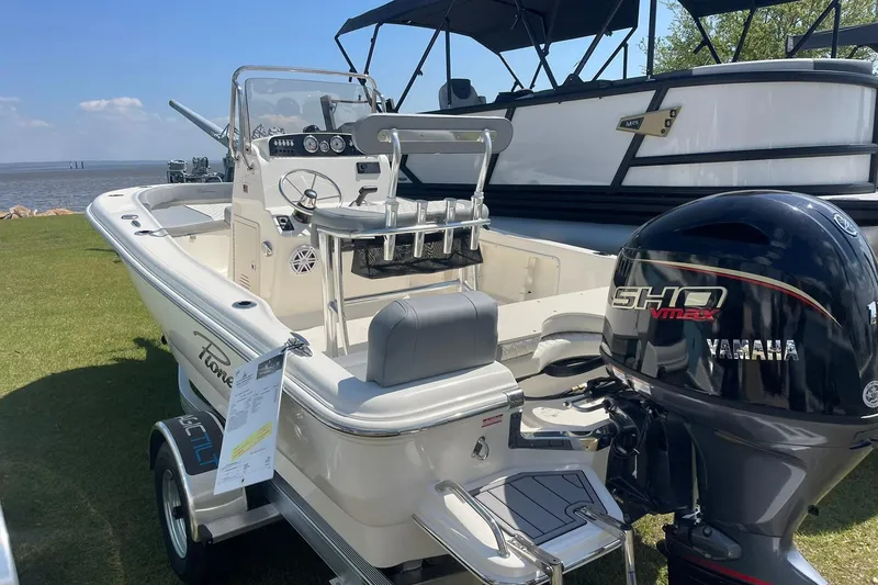 The Image of 2026 Pioneer 180 Islander boat with Yamaha engine displayed outdoors. - 0
