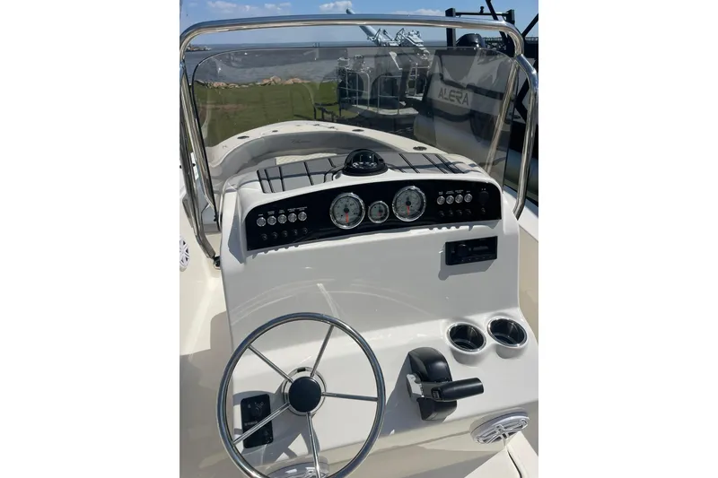 Slide: The Image of Steering console of 2026 Pioneer 180 Islander boat with gauges and controls. - 3