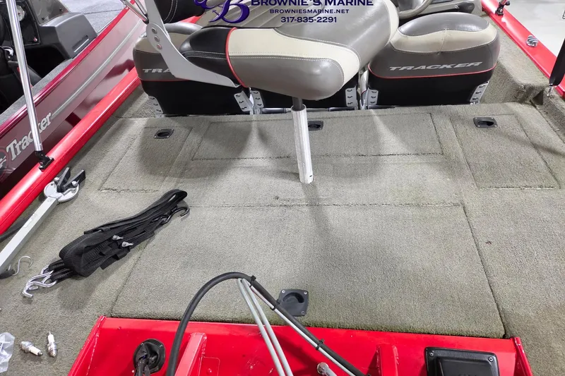Slide: The Image of 2005 Tracker Pro Team 175 boat interior with seating and carpeted deck. - 10