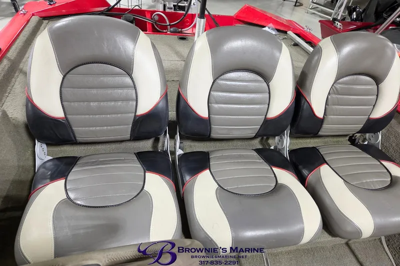 Slide: The Image of 2005 Tracker Pro Team 175 boat seats, gray and white with red accents, at Brownie's Marine. - 5