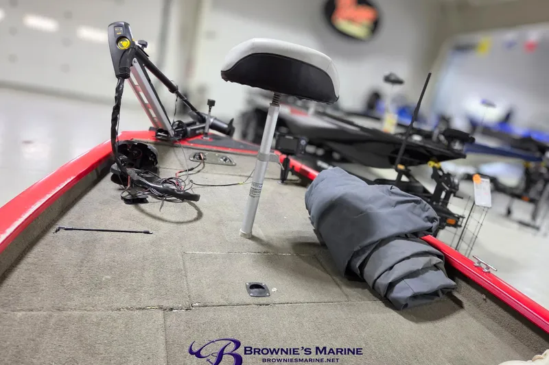 Slide: The Image of 2005 Tracker Pro Team 175 boat interior with fishing seat and equipment. - 6