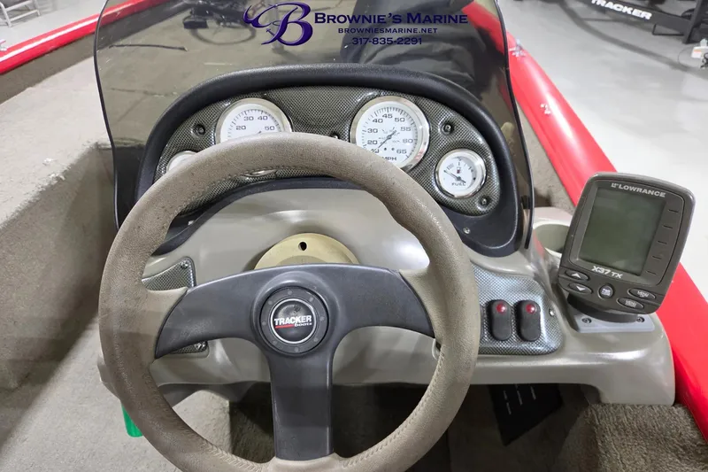 Slide: The Image of 2005 Tracker Pro Team 175 boat dashboard with steering wheel and Lowrance X37 TX fishfinder. - 7