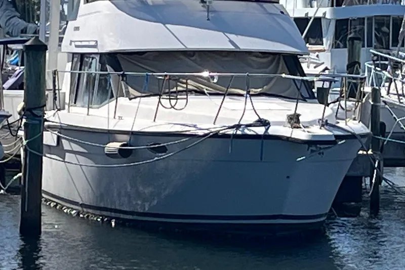 The Image of 1992 Carver 33 Aft Cabin Motor Yacht docked at marina. - 0
