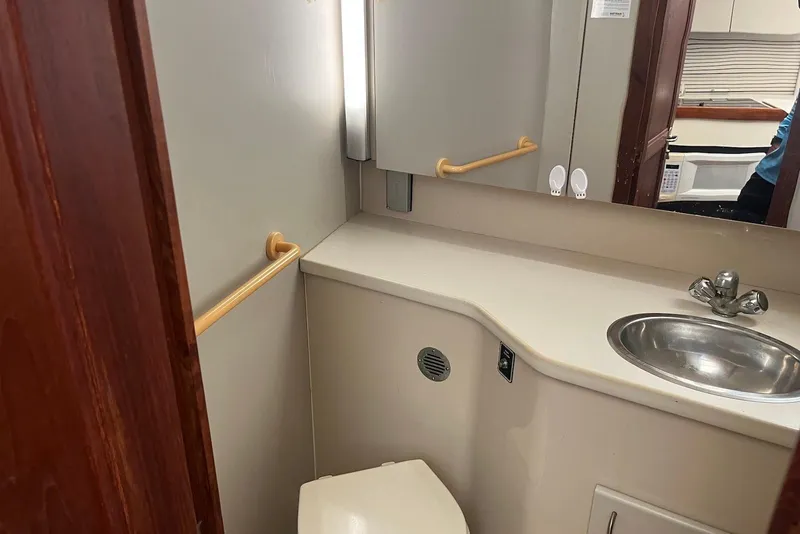 Slide: The Image of Bathroom interior of 1992 Carver 33 Aft Cabin Motor Yacht with sink and mirror. - 15