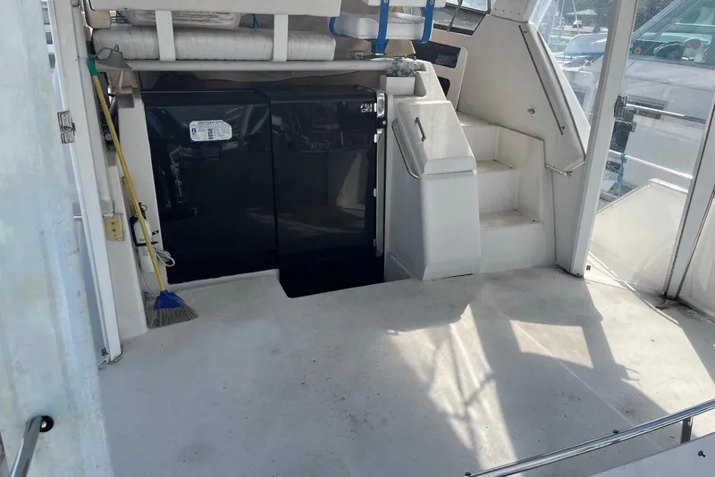 Slide: The Image of Interior of 1992 Carver 33 Aft Cabin Motor Yacht with stairs and storage. - 4