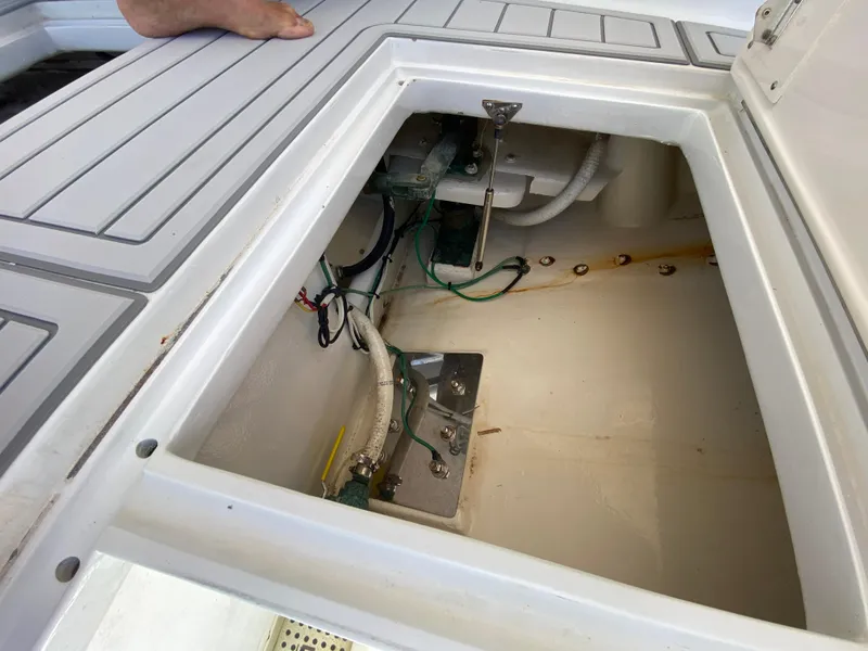 Slide: The Image of Open hatch on 1995 L&H 33 boat showing internal wiring and components. - 40