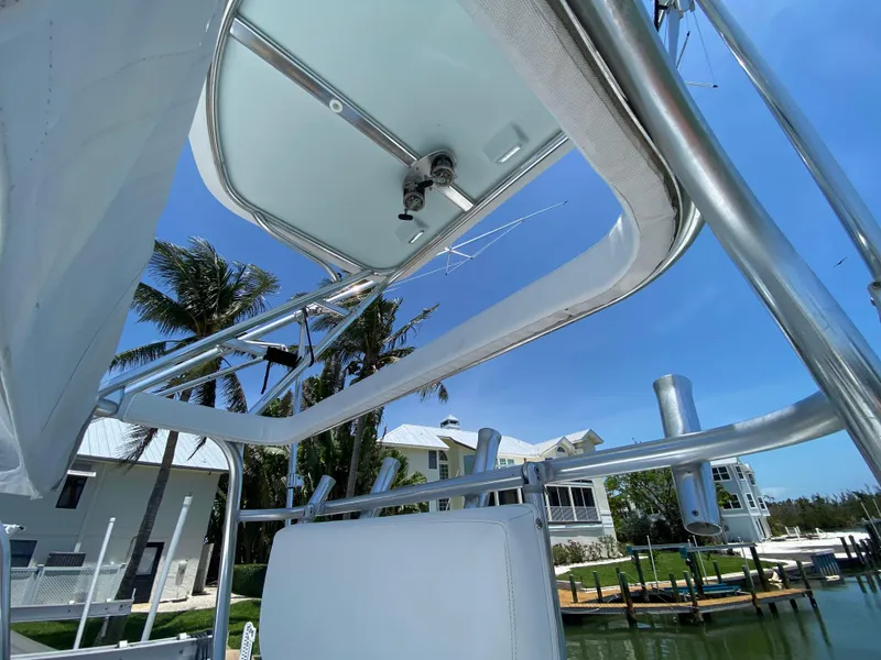 Slide: The Image of View from a 1995 L&H 33 boat, showcasing the canopy and marina backdrop. - 48