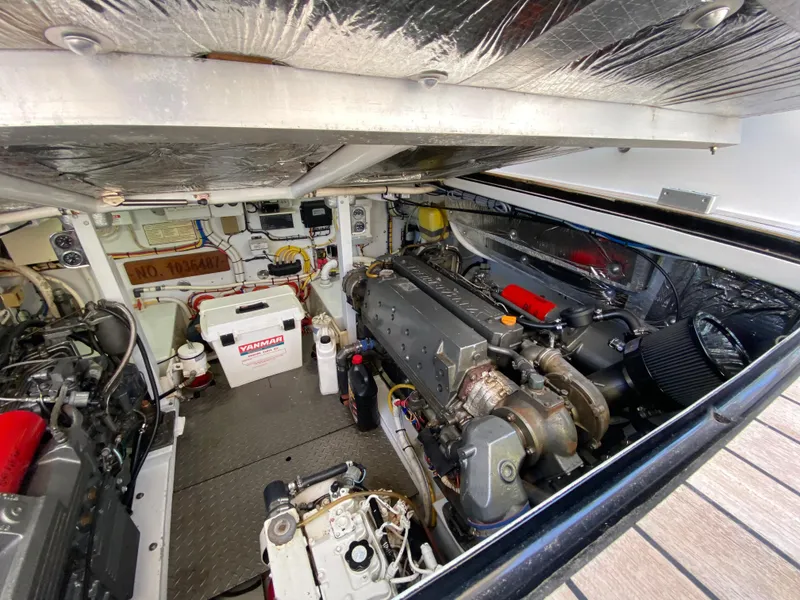 Slide: The Image of Engine room of a 1995 L&H 33 boat, showcasing mechanical components and equipment. - 67