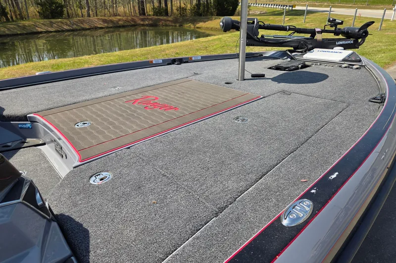 Slide: The Image of 2023 Ranger Z520R 55th Anniversary Limited Edition boat deck with fishing equipment. - 12
